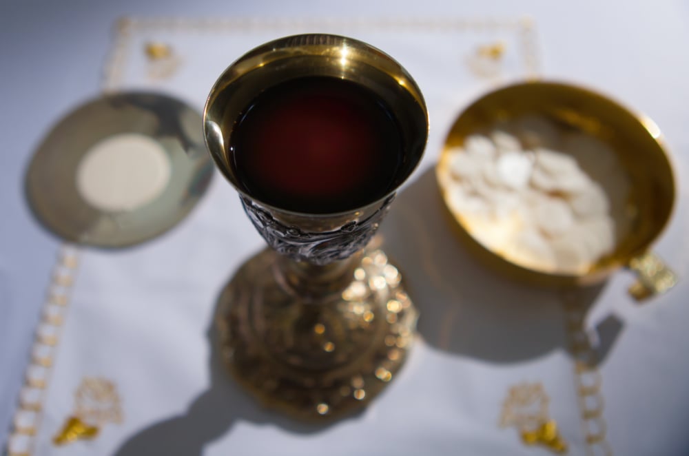 Chalice Large Host and Ciborium on the Altar